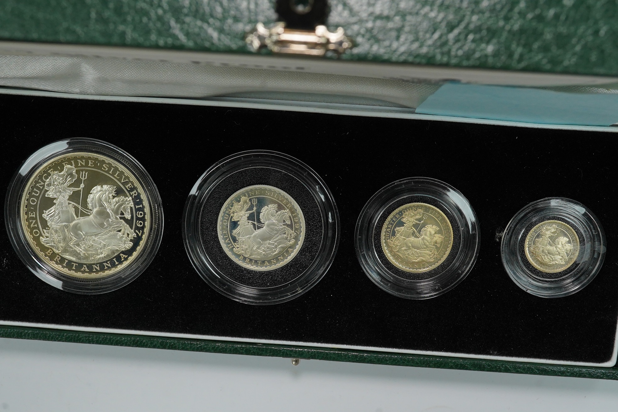 Royal Mint UK QEII coins, four Britannia collection silver proof four-coin sets, 1997, 2001, 2005 and 2007, in case of issue with certificate (4)